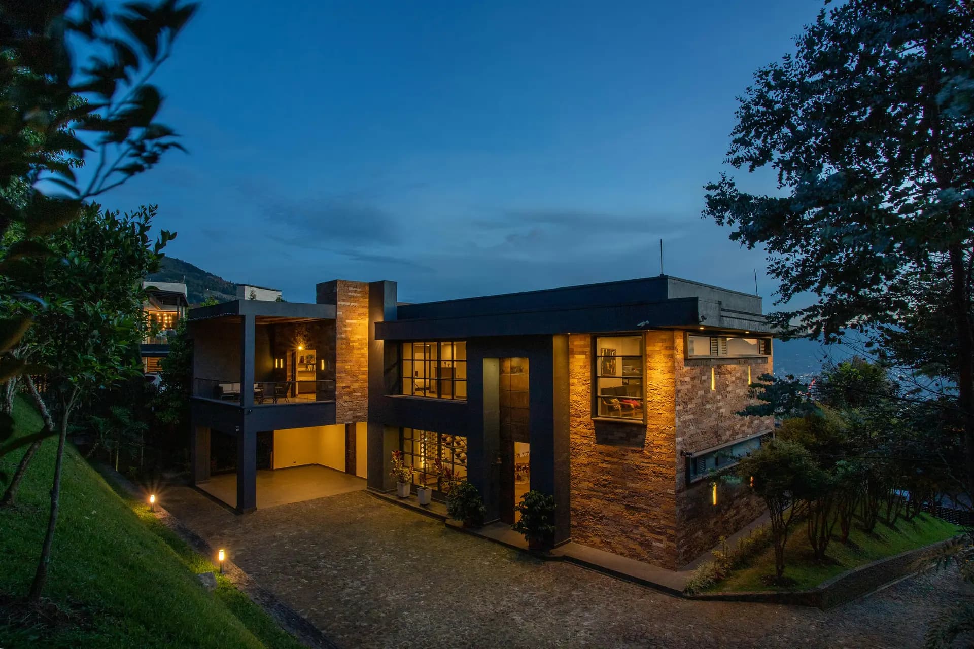 A modern Sri Lankan home glowing at twilight